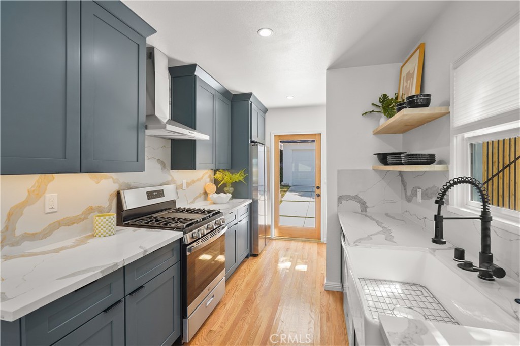775 Morada Place Altadena, CA 91001 - Photo 9 of 24 a kitchen with stainless steel appliances granite countertop a stove and a sink