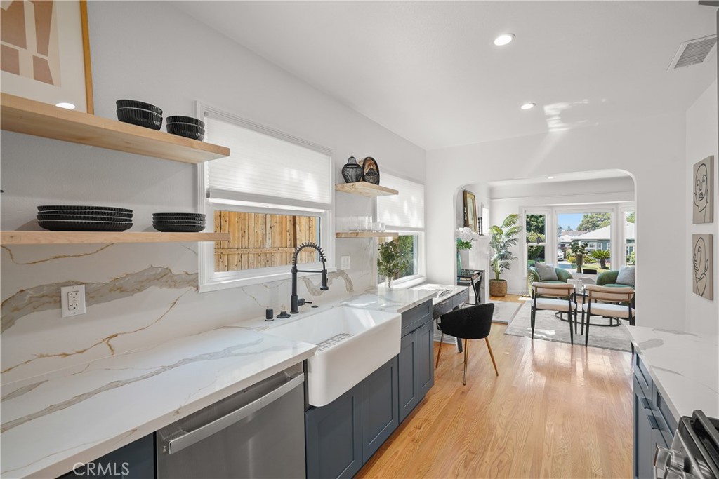 775 Morada Place Altadena, CA 91001 - Photo 10 of 24 a living room with stainless steel appliances kitchen island granite countertop a sink and wooden floor