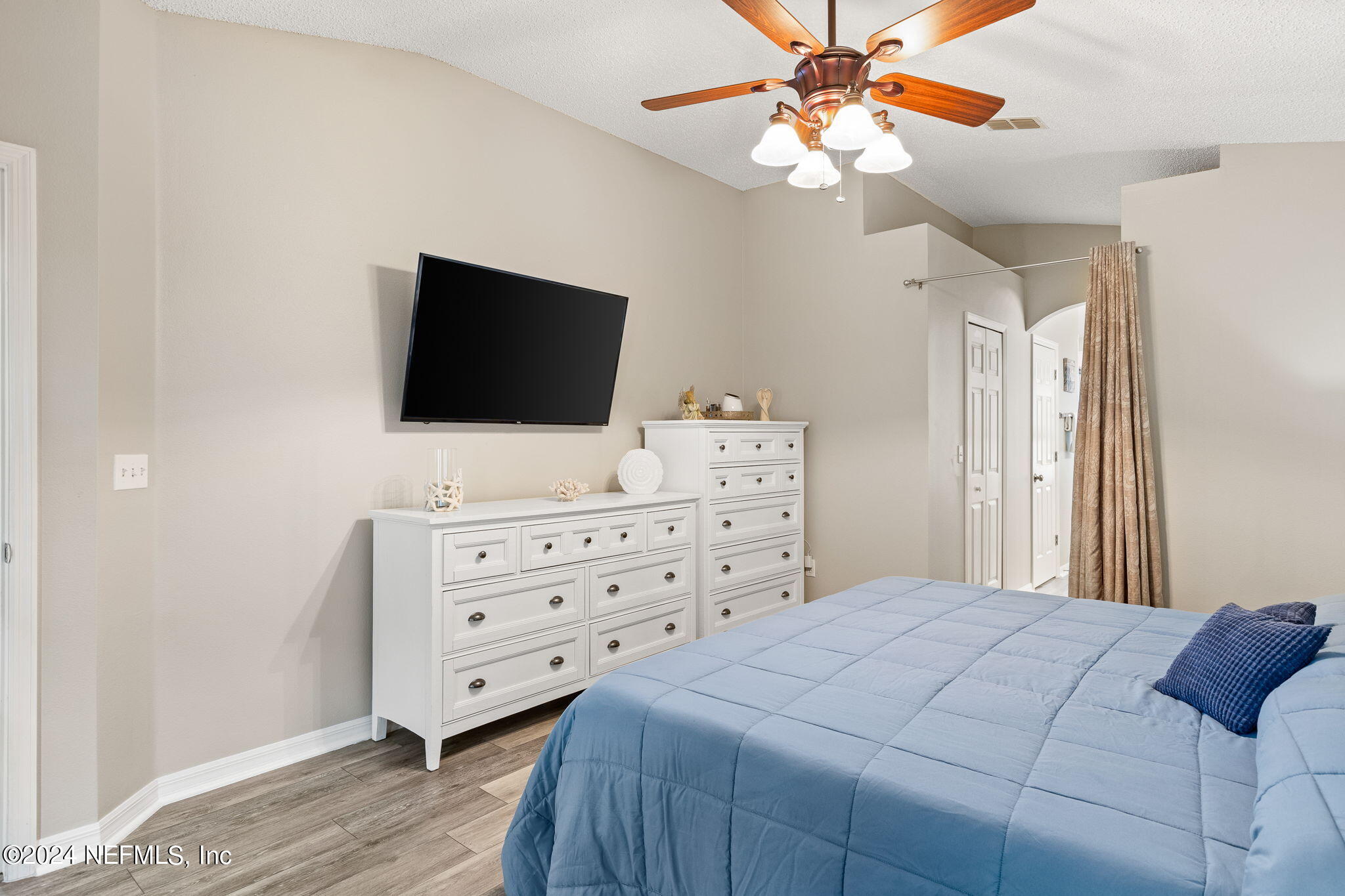 18 Underwick Path Palm Coast, FL 32164 - Photo 12 of 36 a bedroom with a bed and a flat screen tv