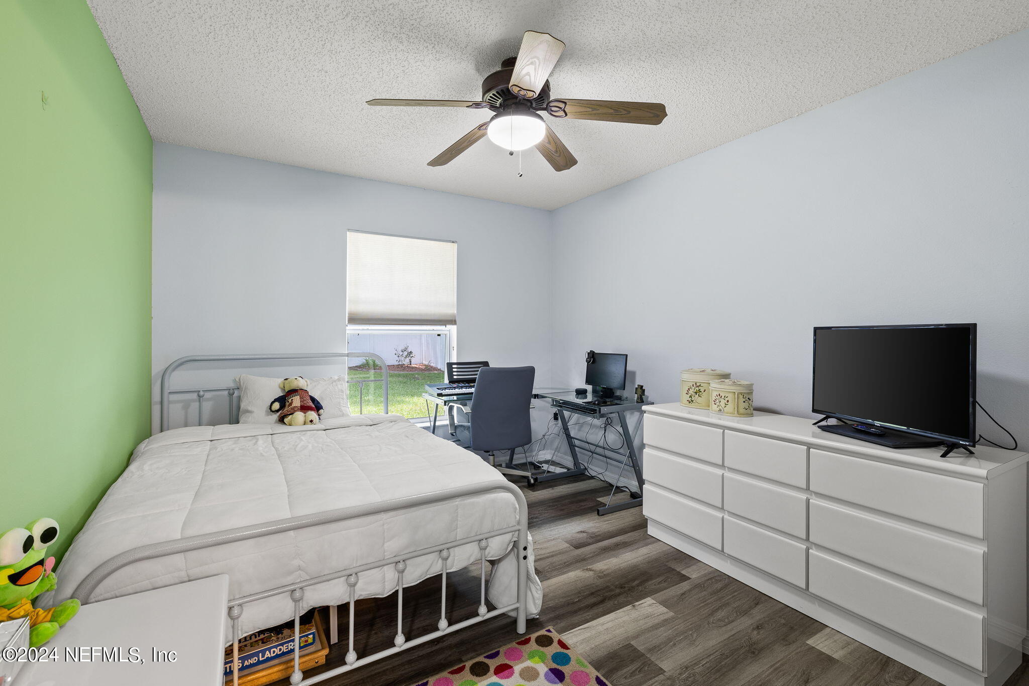 18 Underwick Path Palm Coast, FL 32164 - Photo 20 of 36 a bedroom with a bed and a flat screen tv