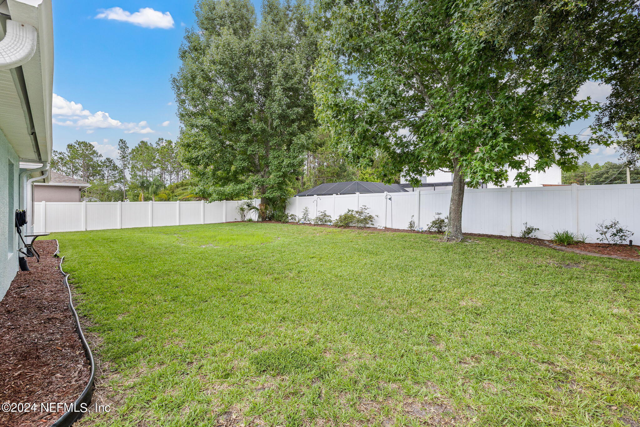 18 Underwick Path Palm Coast, FL 32164 - Photo 25 of 36 a view of a backyard with a garden
