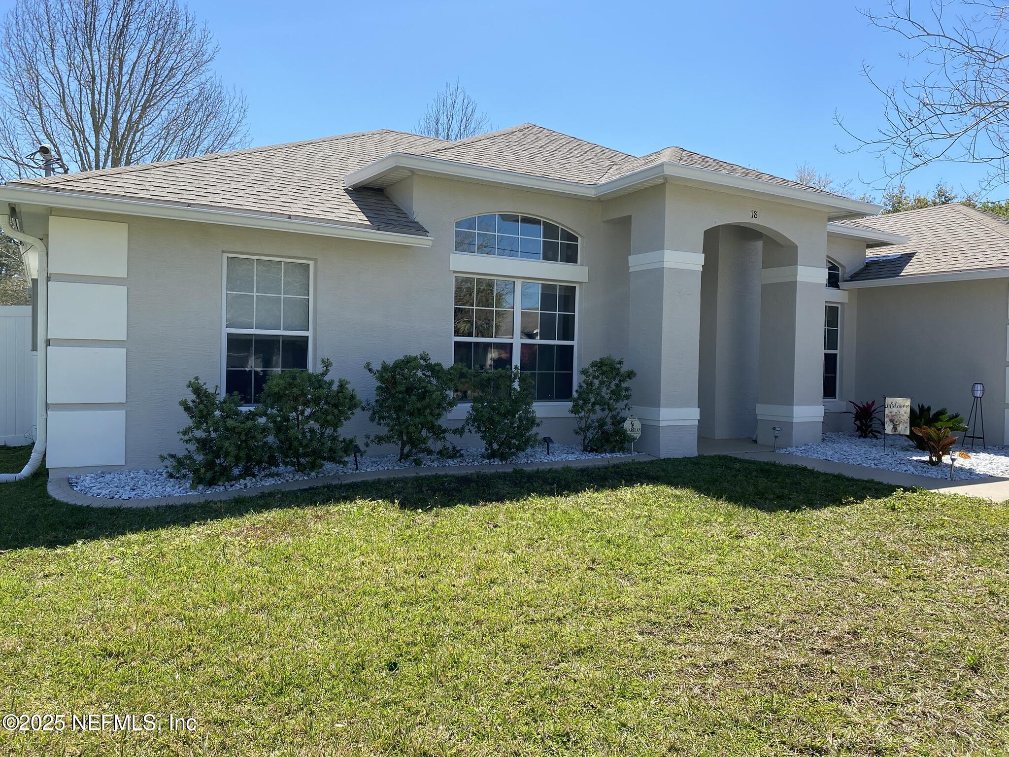 18 Underwick Path Palm Coast, FL 32164 - Photo 26 of 36 a front view of a house with garden