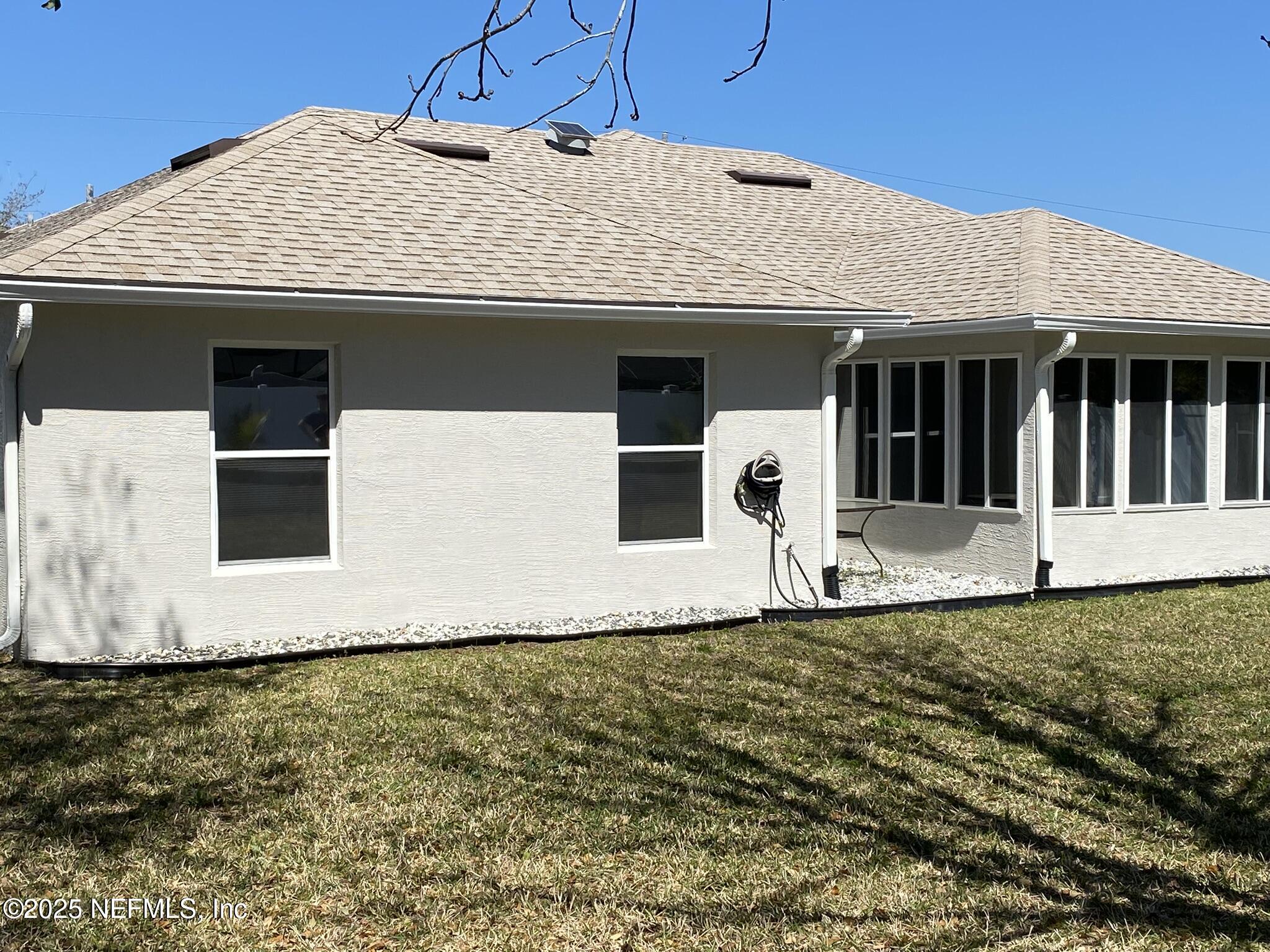 18 Underwick Path Palm Coast, FL 32164 - Photo 30 of 36 a front view of a house with a yard