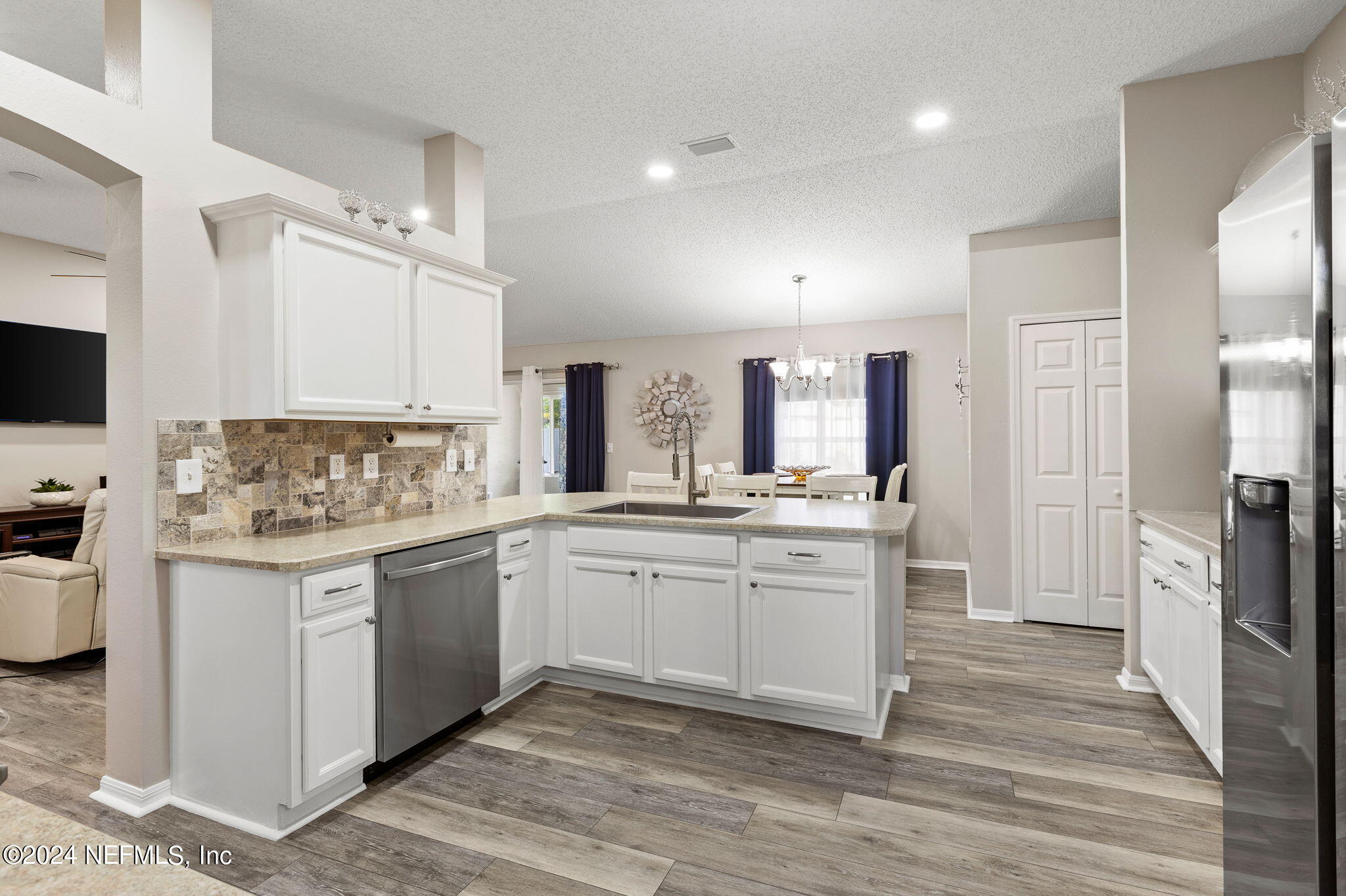 18 Underwick Path Palm Coast, FL 32164 - Photo 7 of 36 a kitchen with a sink stove and refrigerator