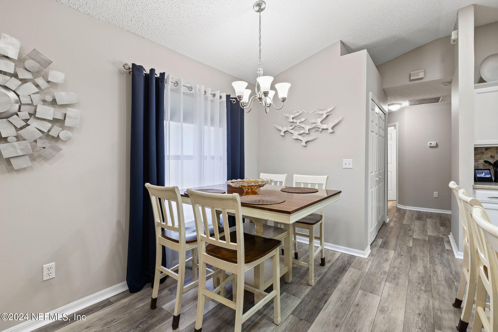 18 Underwick Path Palm Coast, FL 32164 - Photo 10 of 36 a view of a dining room with furniture and wooden floor