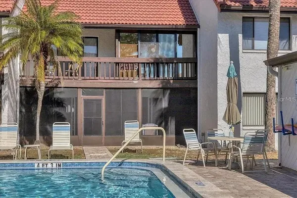 two chairs and a table in a patio