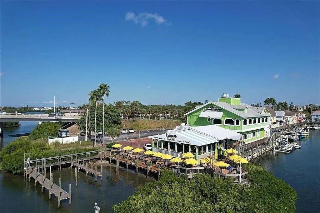 1650 Stickney Point Road, Unit 50202 Sarasota, FL 34231 - Photo 21 of 46 a view of a lake with a city from a lake