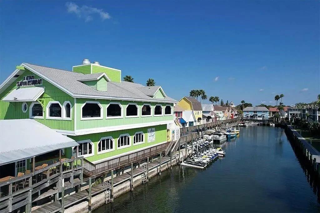 1650 Stickney Point Road, Unit 50202 Sarasota, FL 34231 - Photo 30 of 46 a large building with a view of a swimming pool