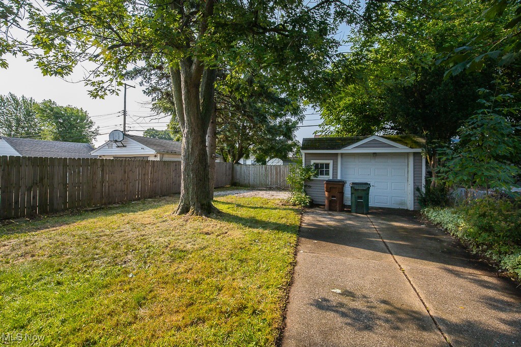 5607 Ridgewood Avenue Parma, OH 44129 - Photo 21 of 23 View of yard featuring a garage and an outbuilding