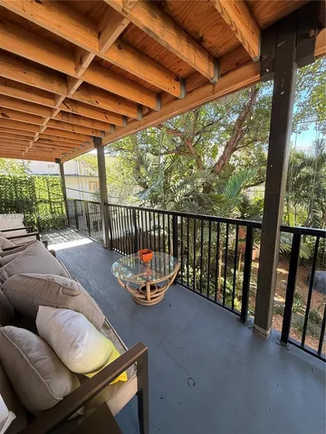 a view of a patio with a table and chairs