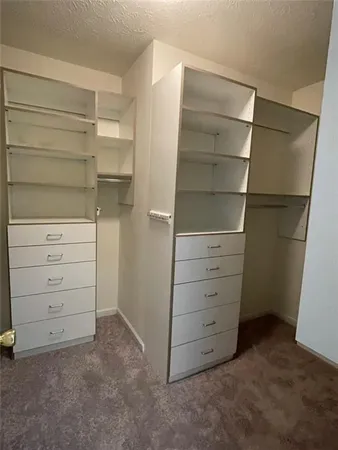 a view of an empty walk in closet
