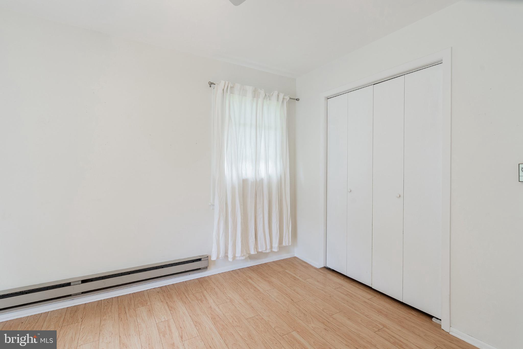 2B Magnolia Road Manahawkin, NJ 08050 - Photo 15 of 37 a view of an empty room with wooden floor