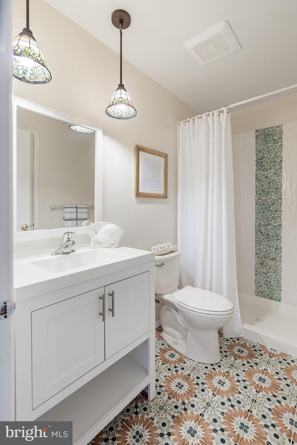 2B Magnolia Road Manahawkin, NJ 08050 - Photo 17 of 37 a bathroom with a sink toilet and shower