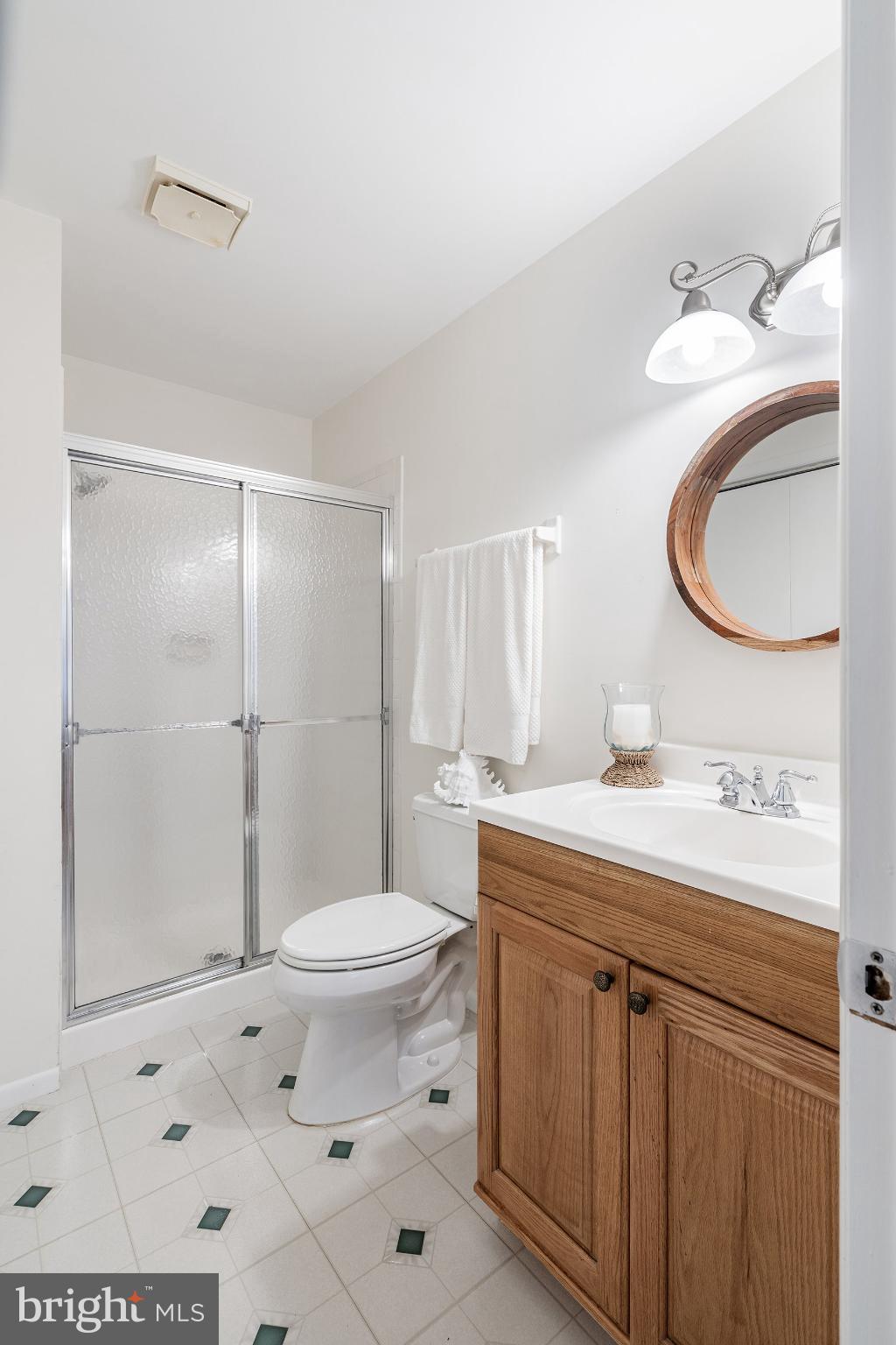 2B Magnolia Road Manahawkin, NJ 08050 - Photo 21 of 37 a bathroom with a sink toilet and shower