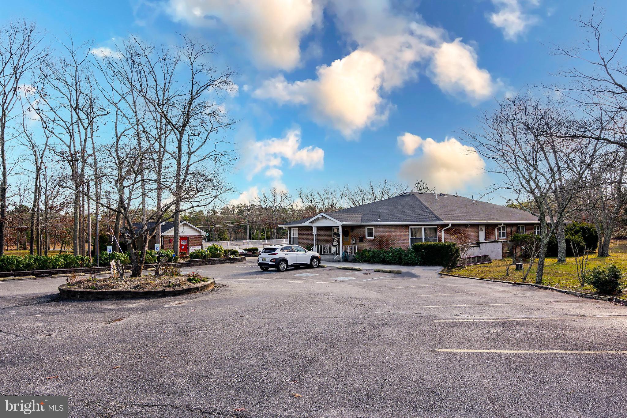 2B Magnolia Road Manahawkin, NJ 08050 - Photo 29 of 37 a view of a parked cars in front of a building
