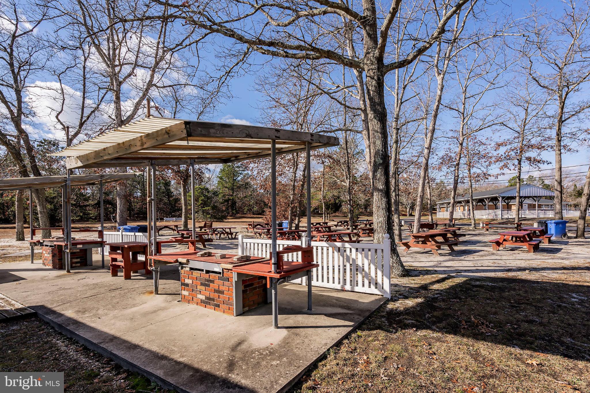 2B Magnolia Road Manahawkin, NJ 08050 - Photo 33 of 37 a view of a patio with chairs and tables