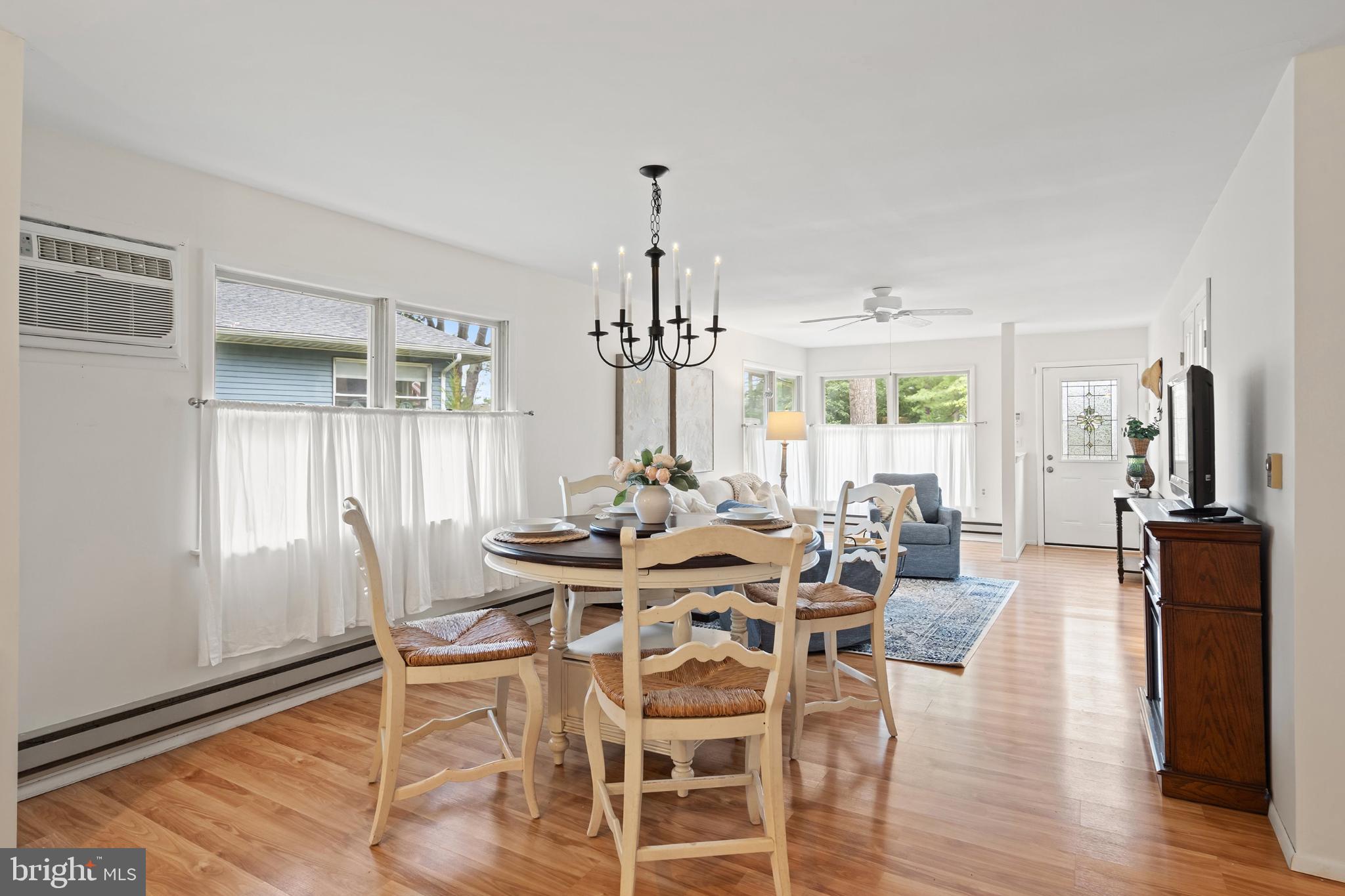 2B Magnolia Road Manahawkin, NJ 08050 - Photo 9 of 37 a view of a dining room with furniture window and wooden floor