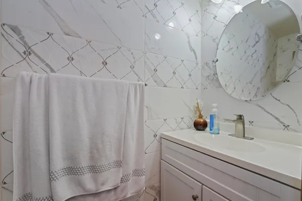 a bathroom with a sink and a shower curtain