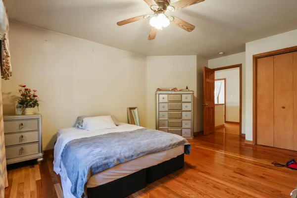 a bedroom with a bed and a dresser