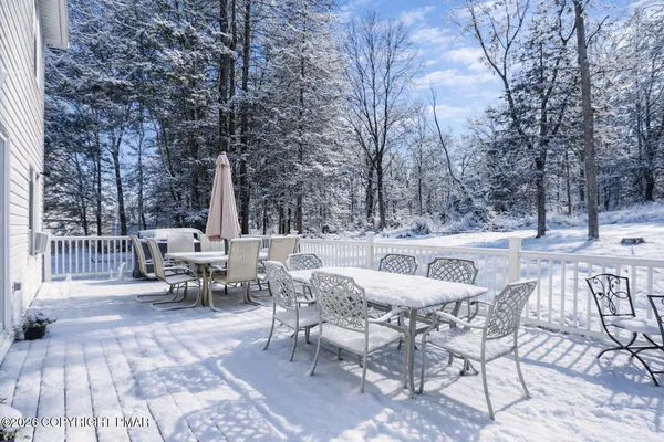 a view of a patio with chairs and tables