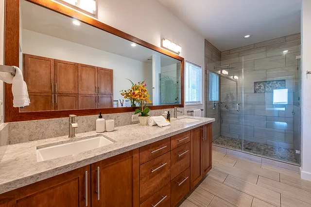 a bathroom with a granite countertop sink mirror and double