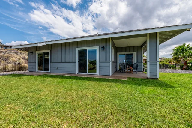 a view of a house with backyard porch and garden
