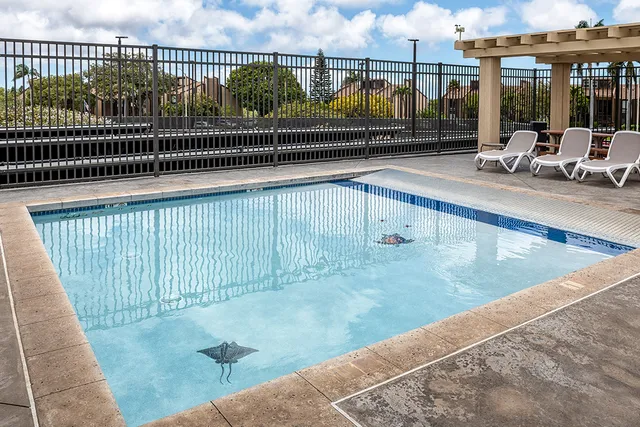 a view of swimming pool with outdoor seating