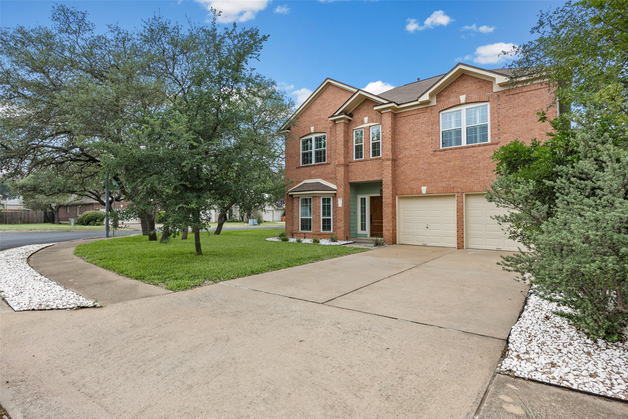 8610 Axis Drive Austin, TX 78749 - Photo 1 of 29 a front view of a house with a yard and garage