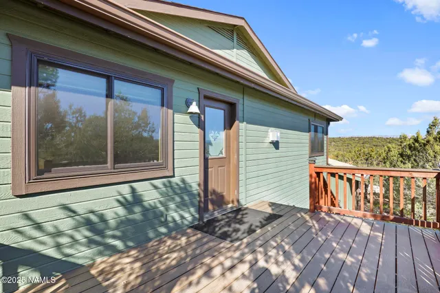 a kitchen with stainless steel appliances granite countertop a sink a stove and cabinets