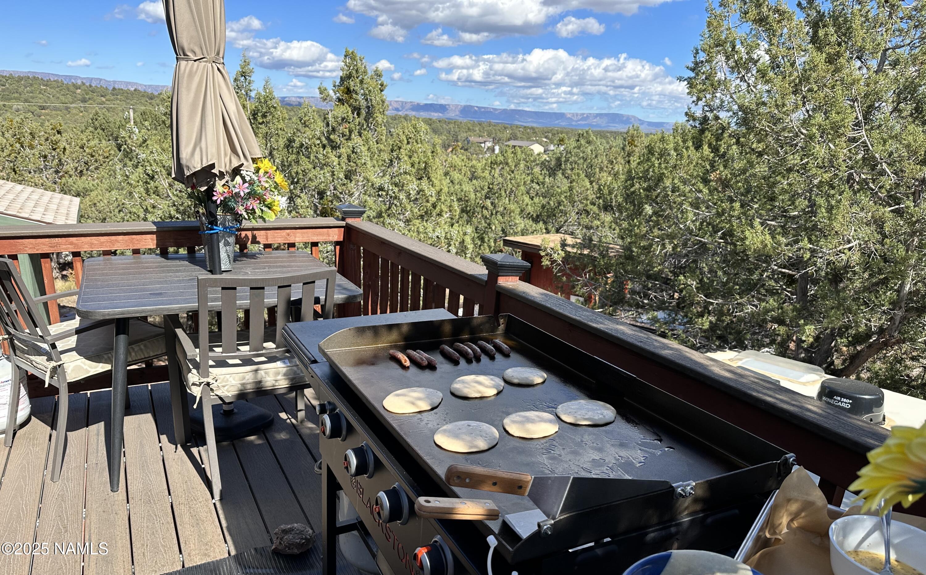 801 North Madison Drive Payson, AZ 85541 - Photo 12 of 50 a view of city from a balcony dining table and chairs