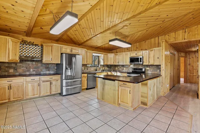 a view of a house with a door and wooden walls