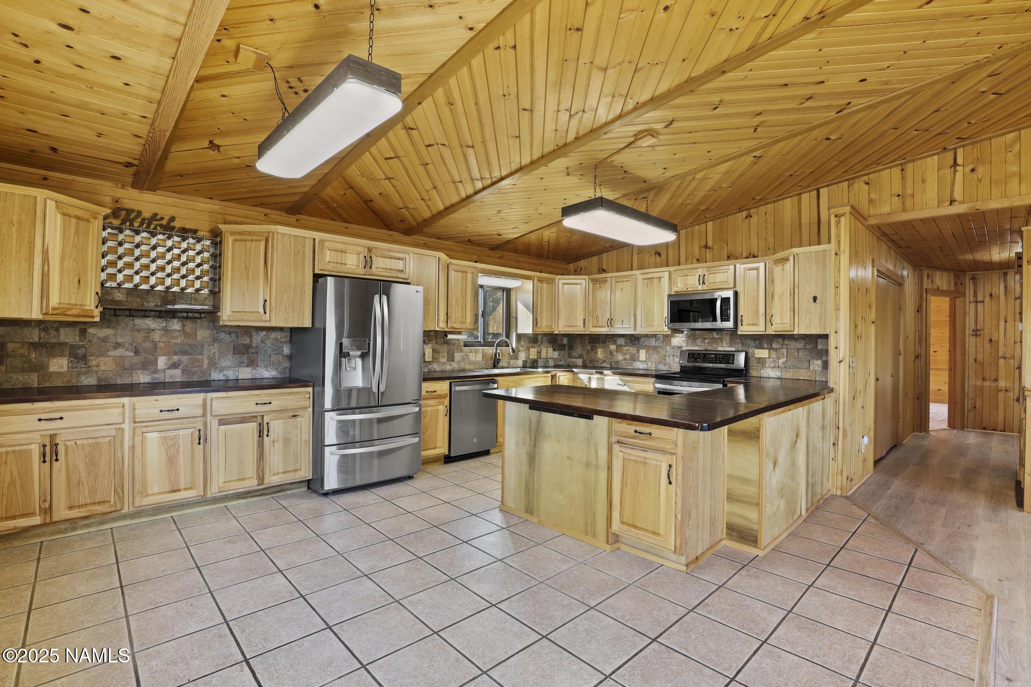 801 North Madison Drive Payson, AZ 85541 - Photo 17 of 50 a kitchen with stainless steel appliances granite countertop a sink and cabinets