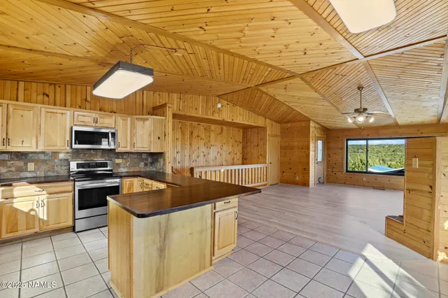 a view of a livingroom with a window and a ceiling fan