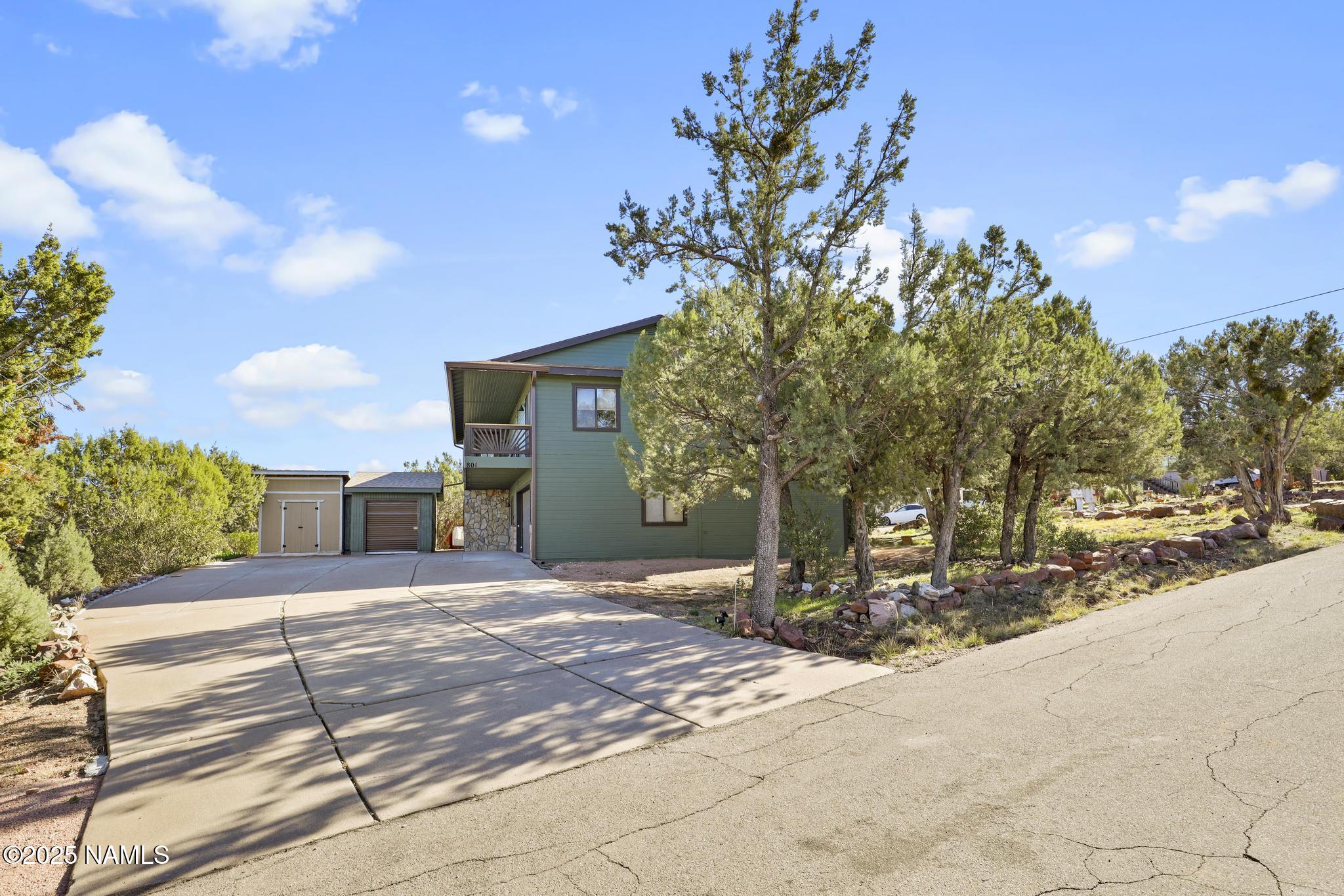801 North Madison Drive Payson, AZ 85541 - Photo 34 of 50 a view of a house with a tree in the background