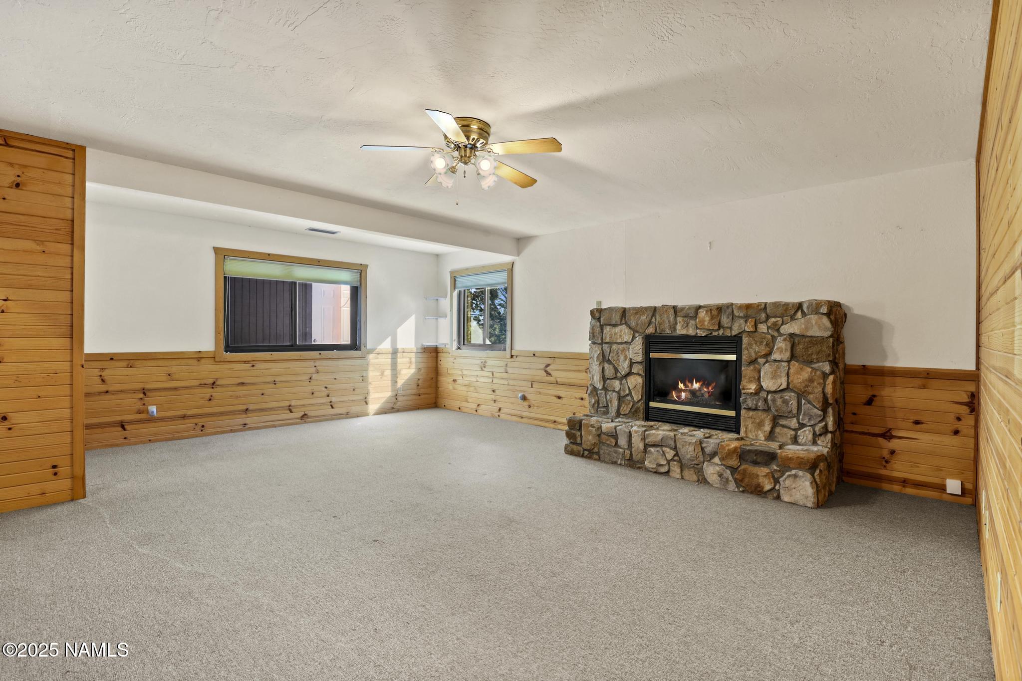 801 North Madison Drive Payson, AZ 85541 - Photo 35 of 50 an empty room with furniture and a fireplace