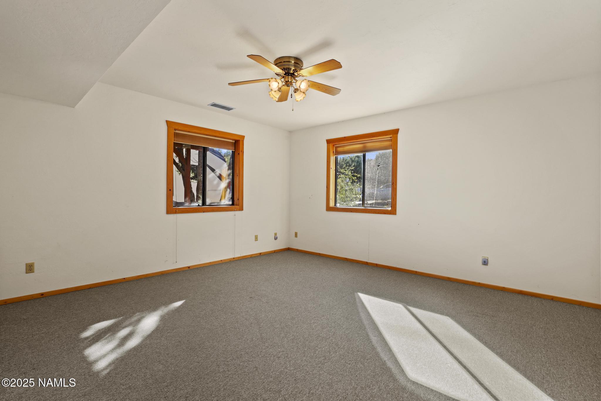 801 North Madison Drive Payson, AZ 85541 - Photo 37 of 50 a view of a livingroom with a window and a ceiling fan
