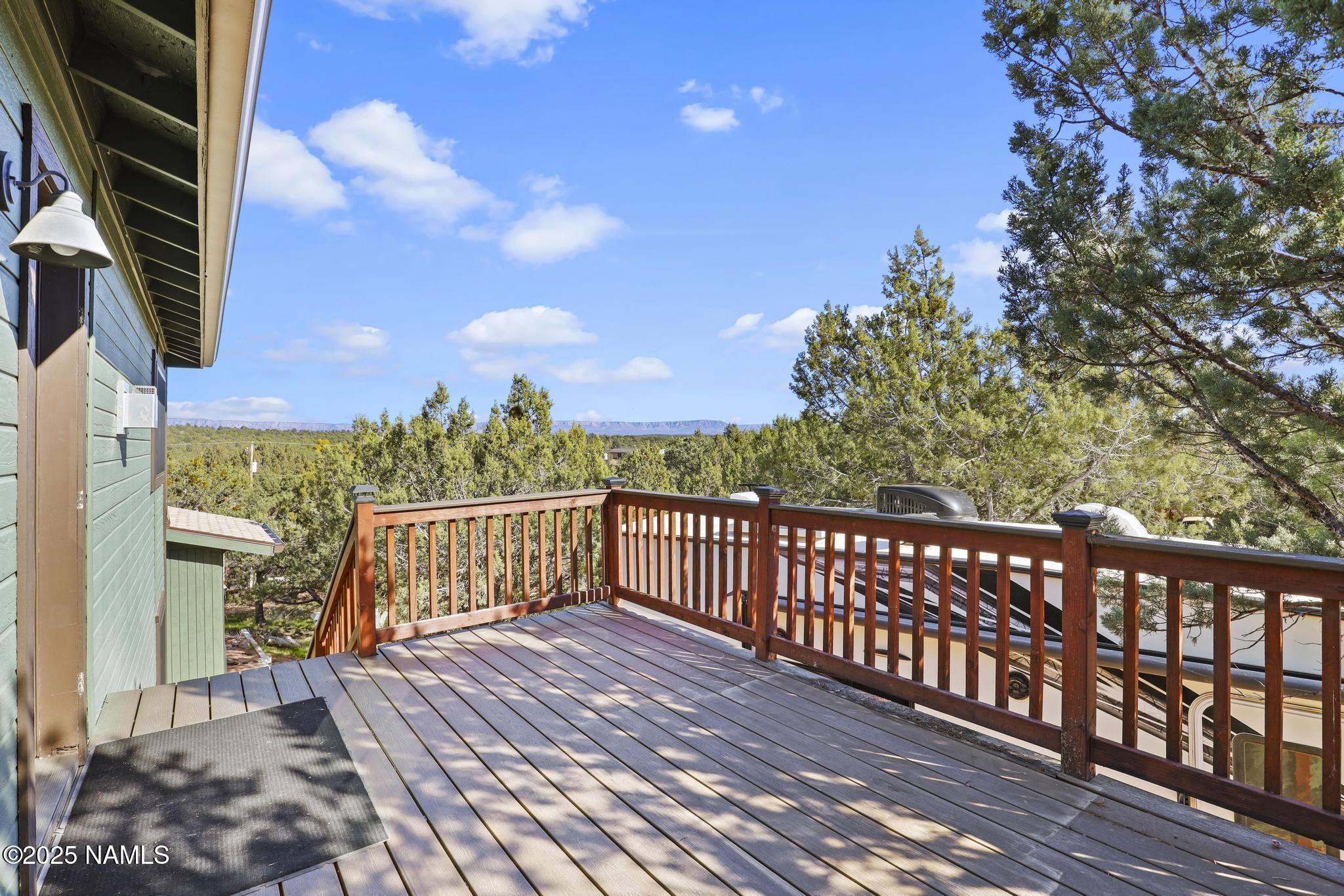 801 North Madison Drive Payson, AZ 85541 - Photo 9 of 50 a view of a balcony with wooden floor