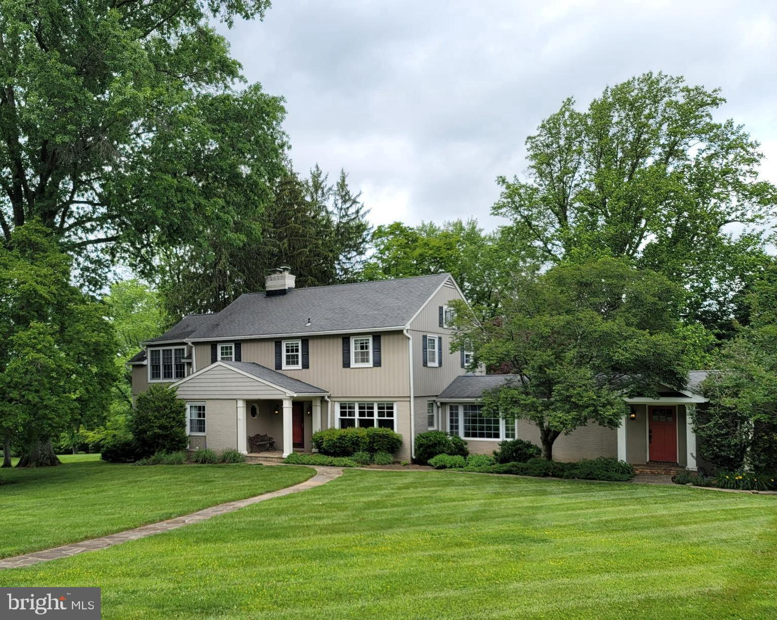2424 Stanwick Road Phoenix, MD 21131 - Photo 1 of 67 a front view of a house with a garden