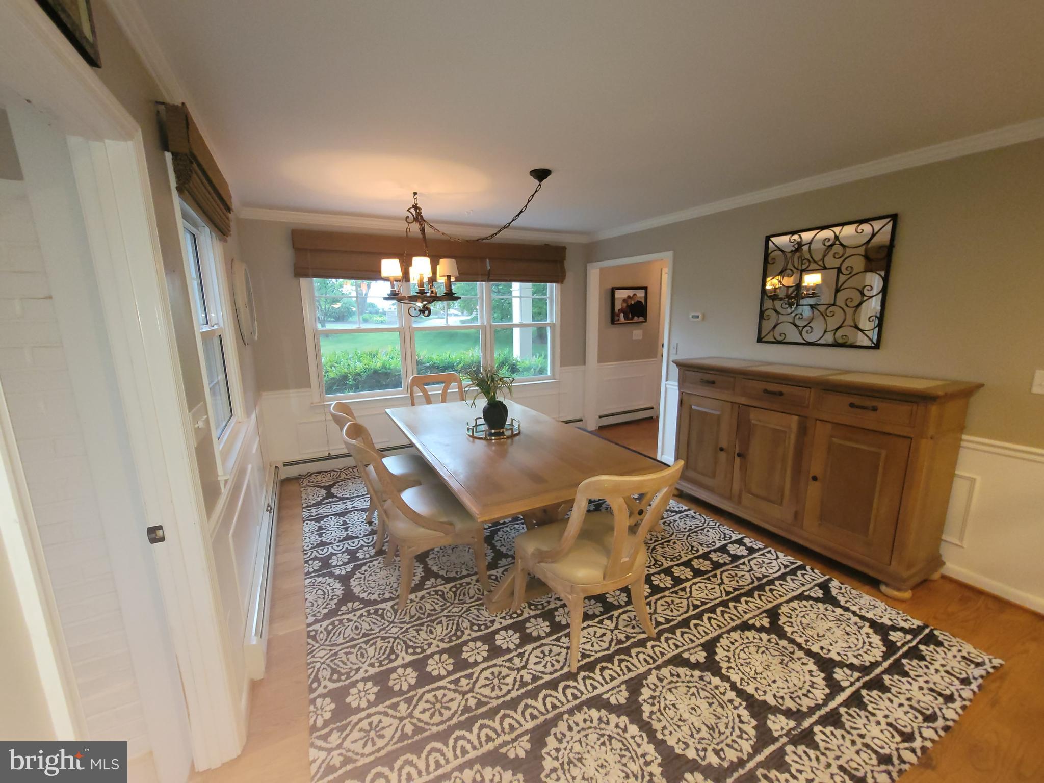 2424 Stanwick Road Phoenix, MD 21131 - Photo 12 of 67 a view of a dining room with furniture window and wooden floor