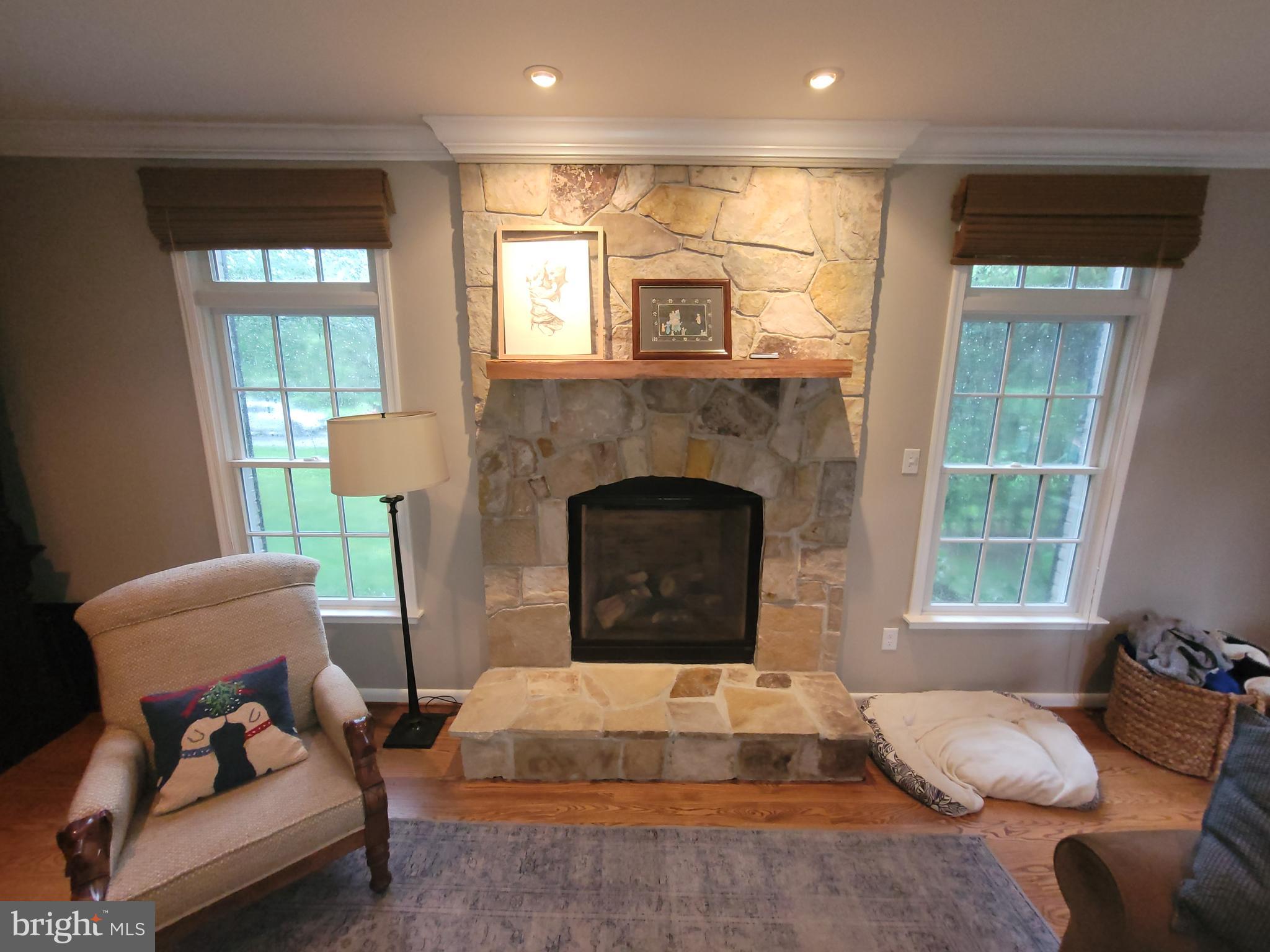 2424 Stanwick Road Phoenix, MD 21131 - Photo 18 of 67 a living room with furniture and a fireplace