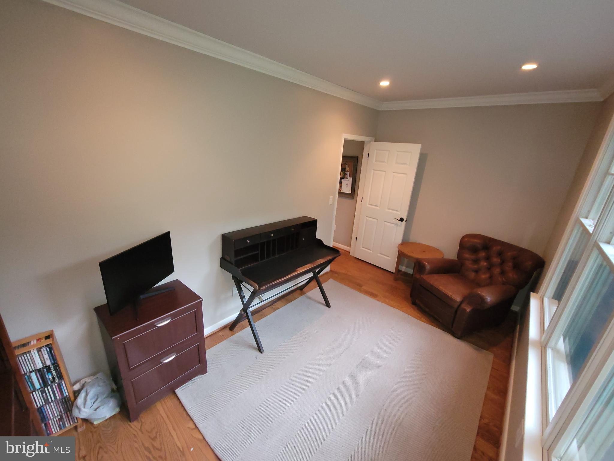 2424 Stanwick Road Phoenix, MD 21131 - Photo 21 of 67 a living room with furniture and a flat screen tv