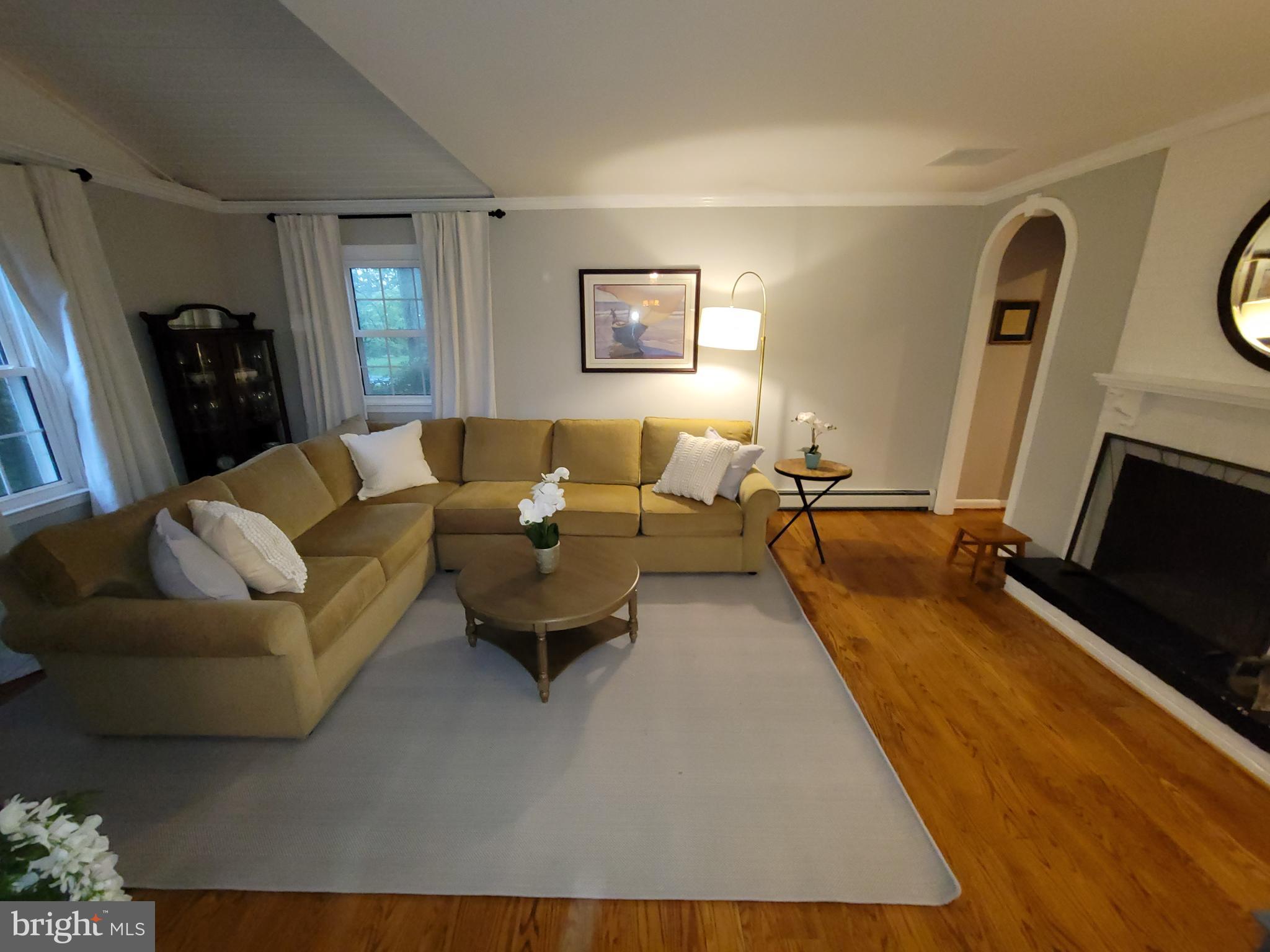 2424 Stanwick Road Phoenix, MD 21131 - Photo 22 of 67 a living room with furniture and a flat screen tv