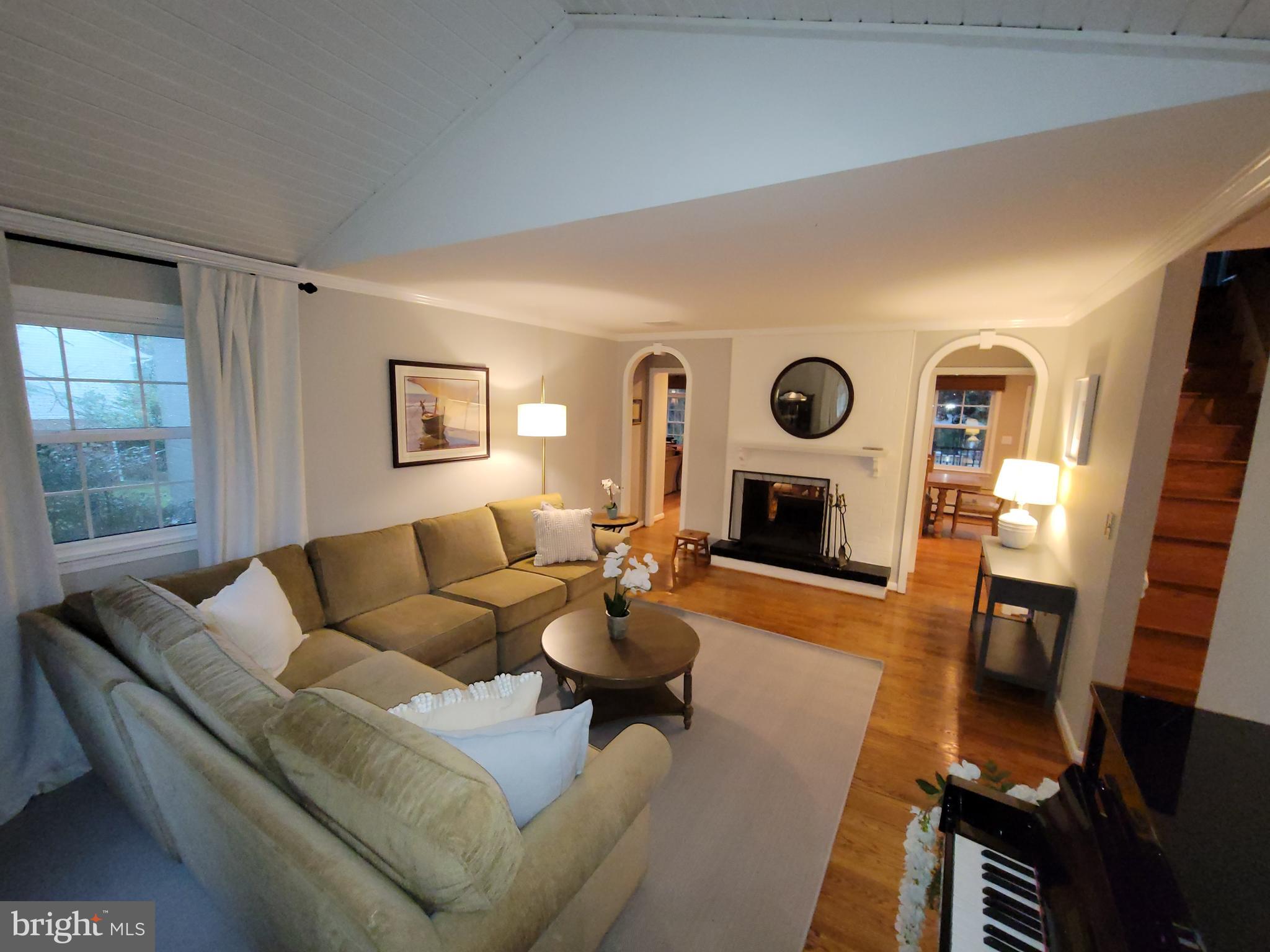 2424 Stanwick Road Phoenix, MD 21131 - Photo 23 of 67 a living room with fireplace furniture and a wooden floor