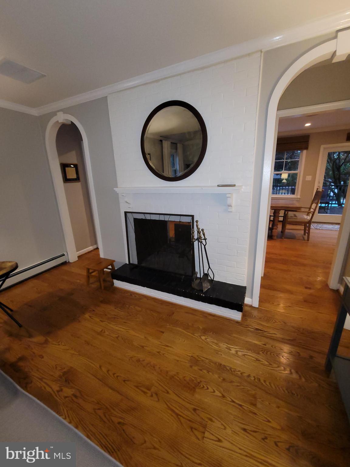 2424 Stanwick Road Phoenix, MD 21131 - Photo 24 of 67 a living room with furniture and a fireplace