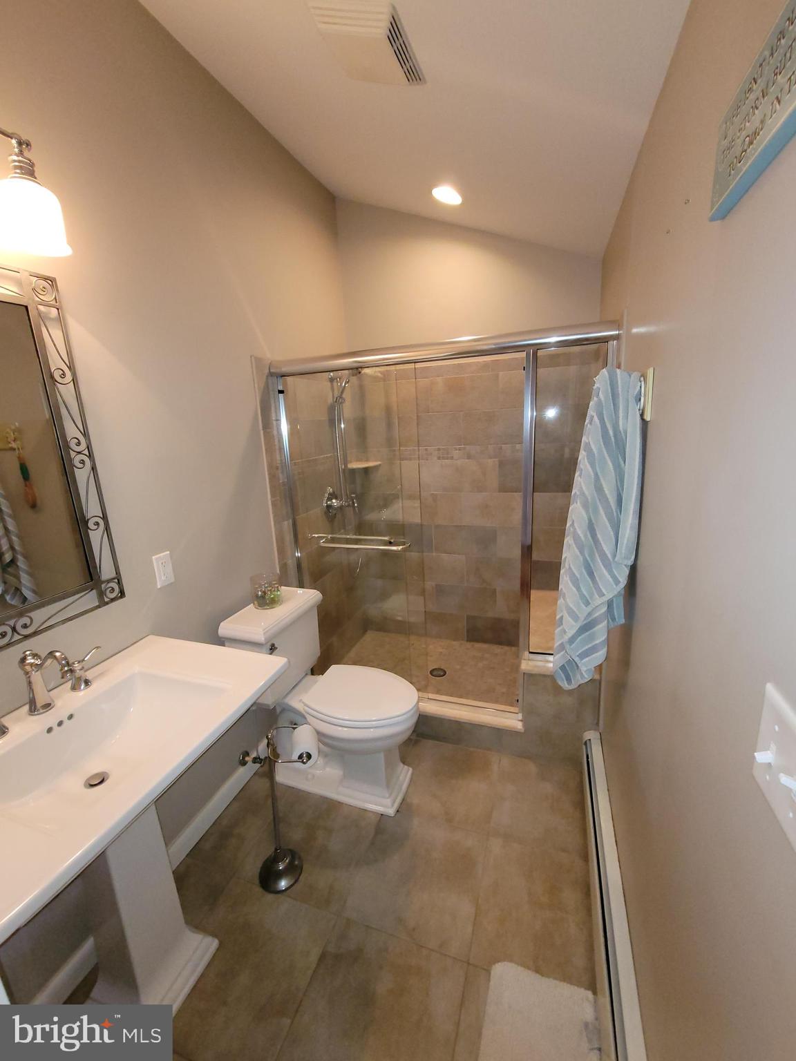 2424 Stanwick Road Phoenix, MD 21131 - Photo 29 of 67 a bathroom with a sink toilet and shower