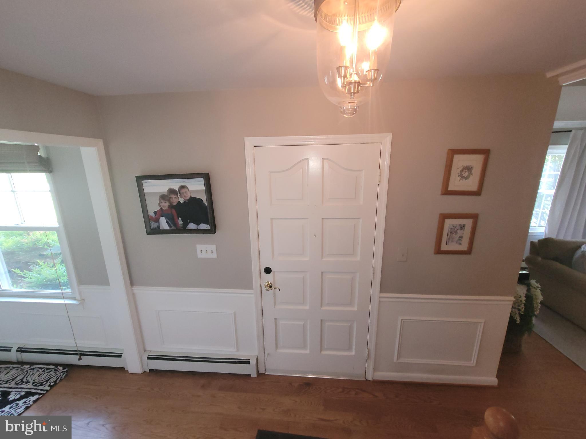 2424 Stanwick Road Phoenix, MD 21131 - Photo 30 of 67 a view of livingroom with hardwood floor and hallway