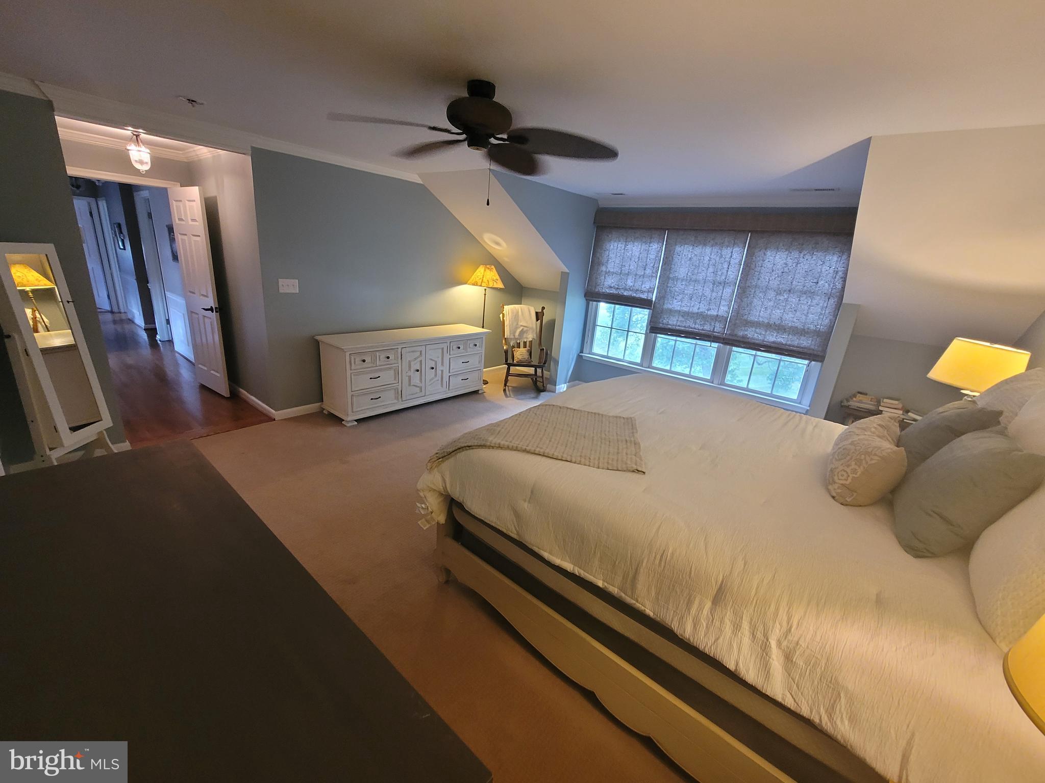 2424 Stanwick Road Phoenix, MD 21131 - Photo 34 of 67 a bedroom with a bed a dresser and a large mirror