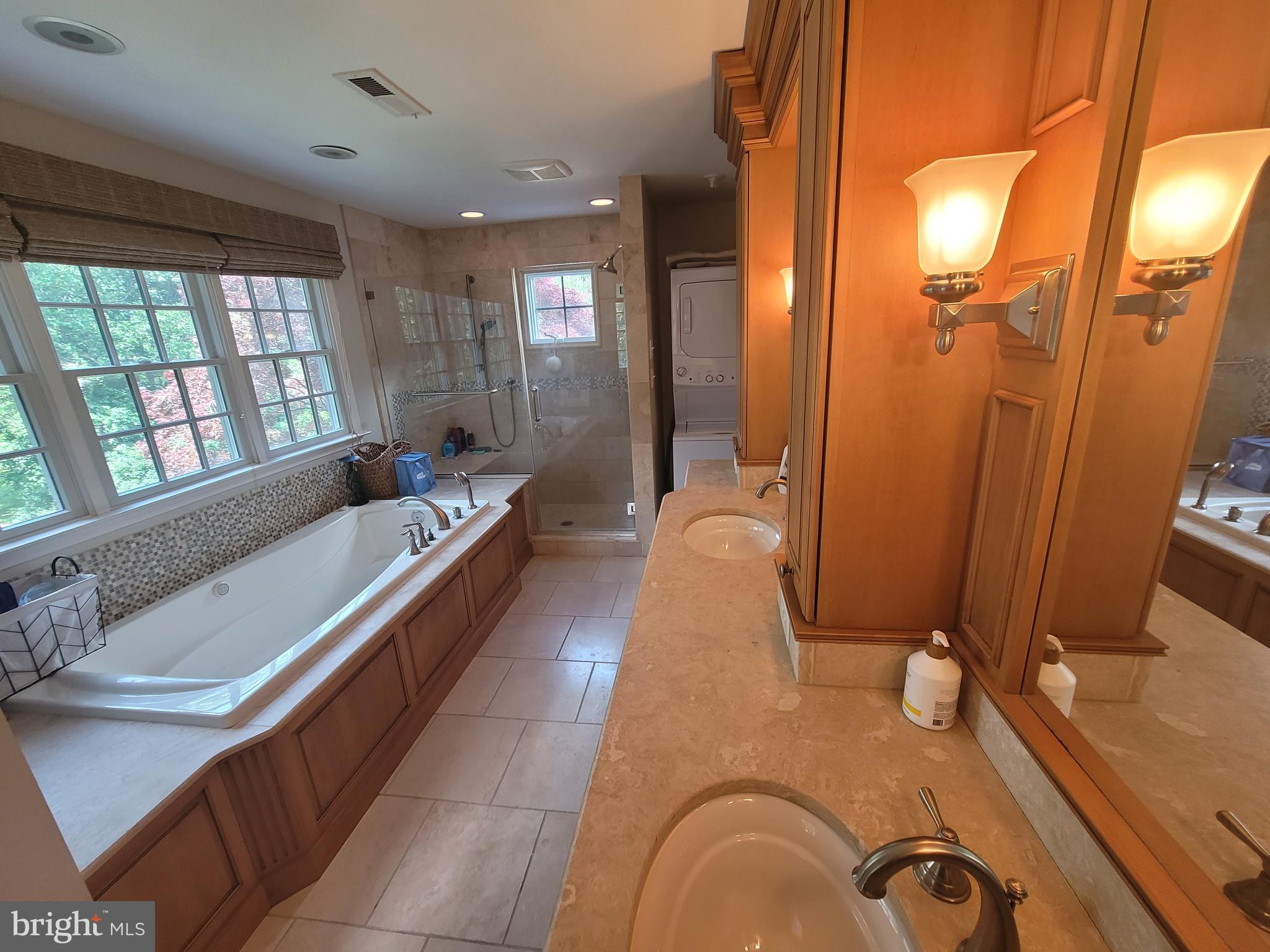 2424 Stanwick Road Phoenix, MD 21131 - Photo 37 of 67 a spacious bathroom with a granite countertop tub sink and mirror