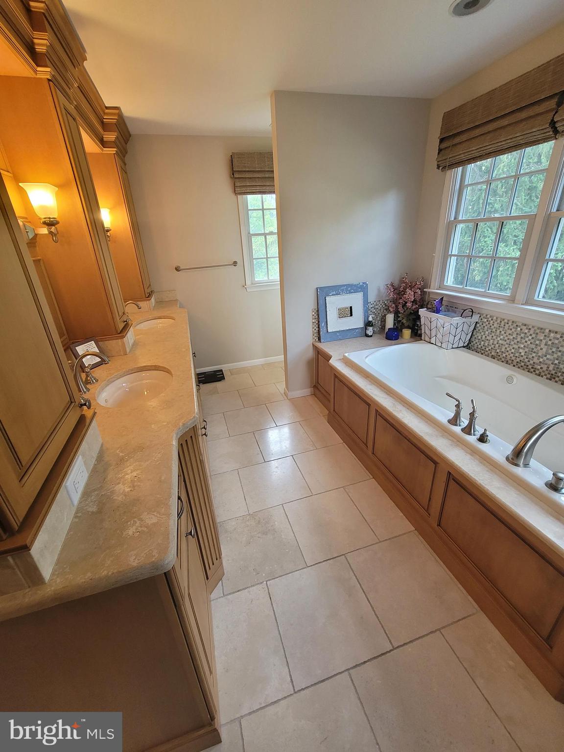2424 Stanwick Road Phoenix, MD 21131 - Photo 38 of 67 a bathroom with a tub sink and mirror
