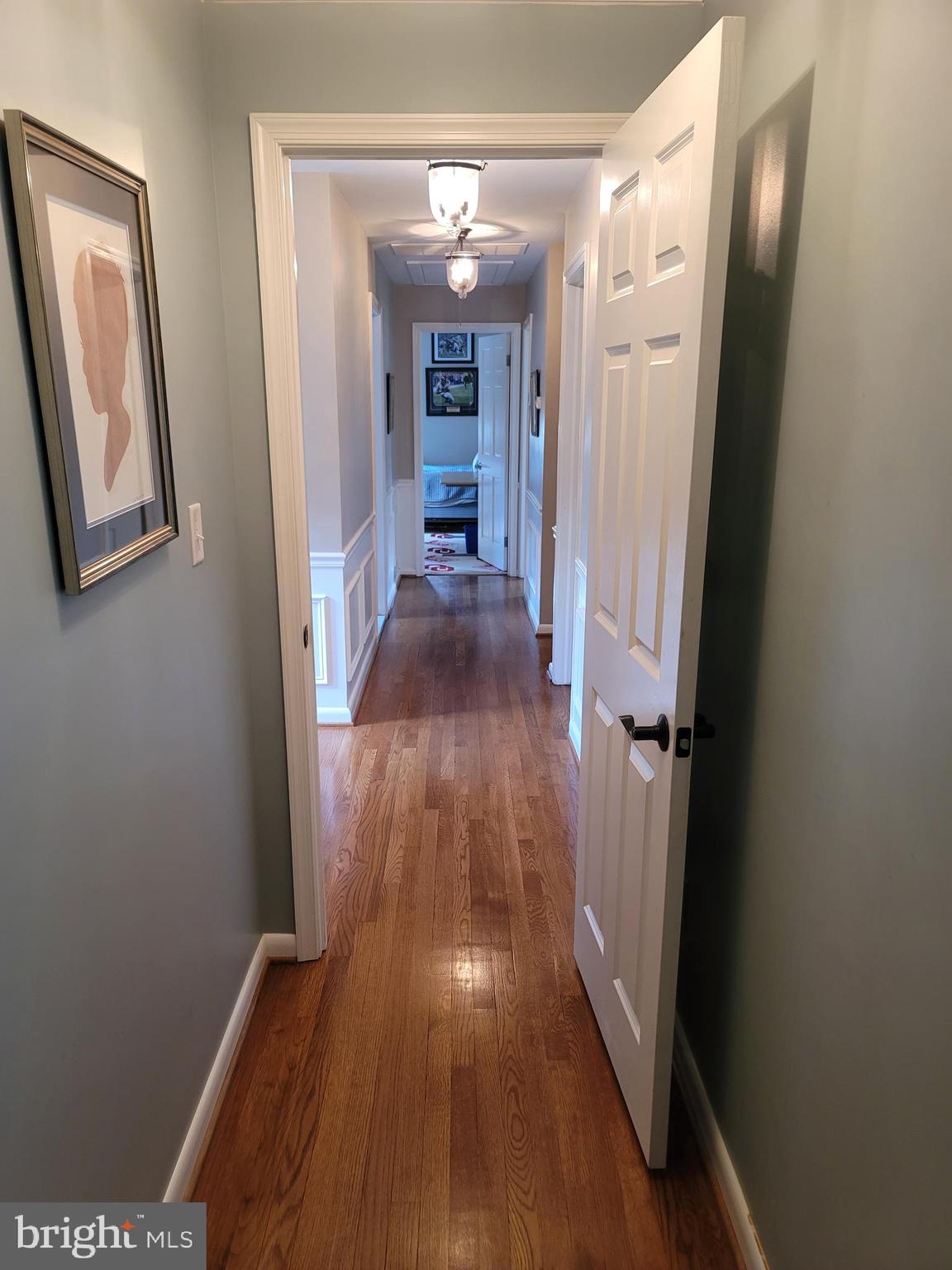 2424 Stanwick Road Phoenix, MD 21131 - Photo 42 of 67 a view of a hallway with wooden floor and staircase